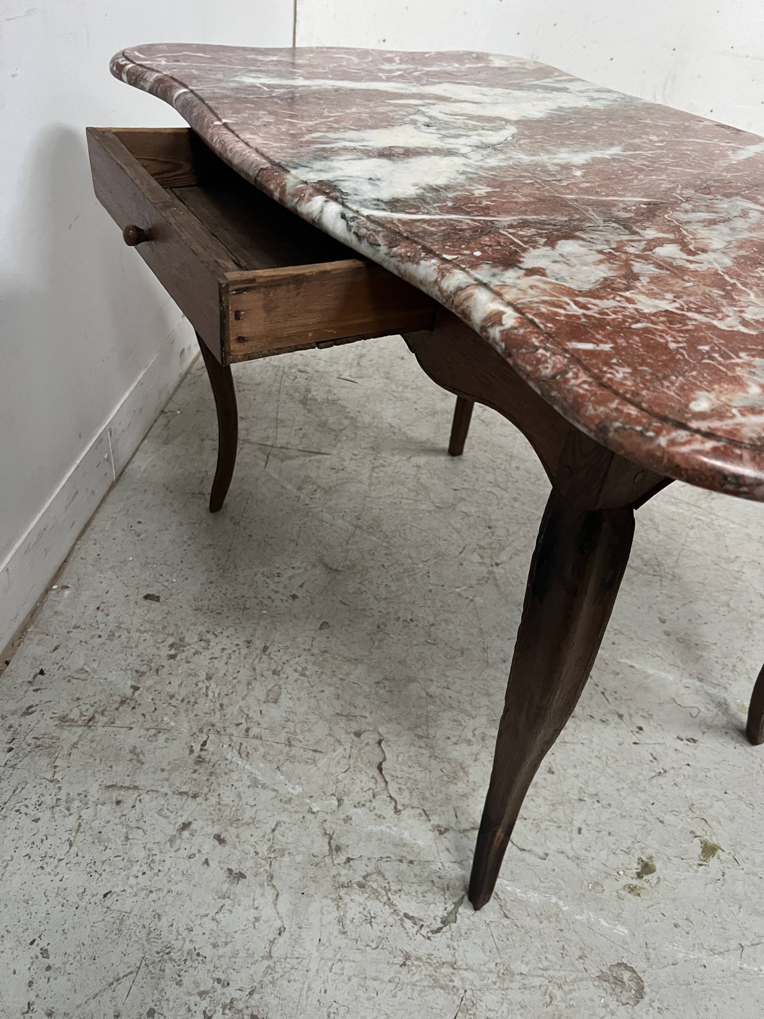 Louis XV mid-table in oak and marble, 18th century.