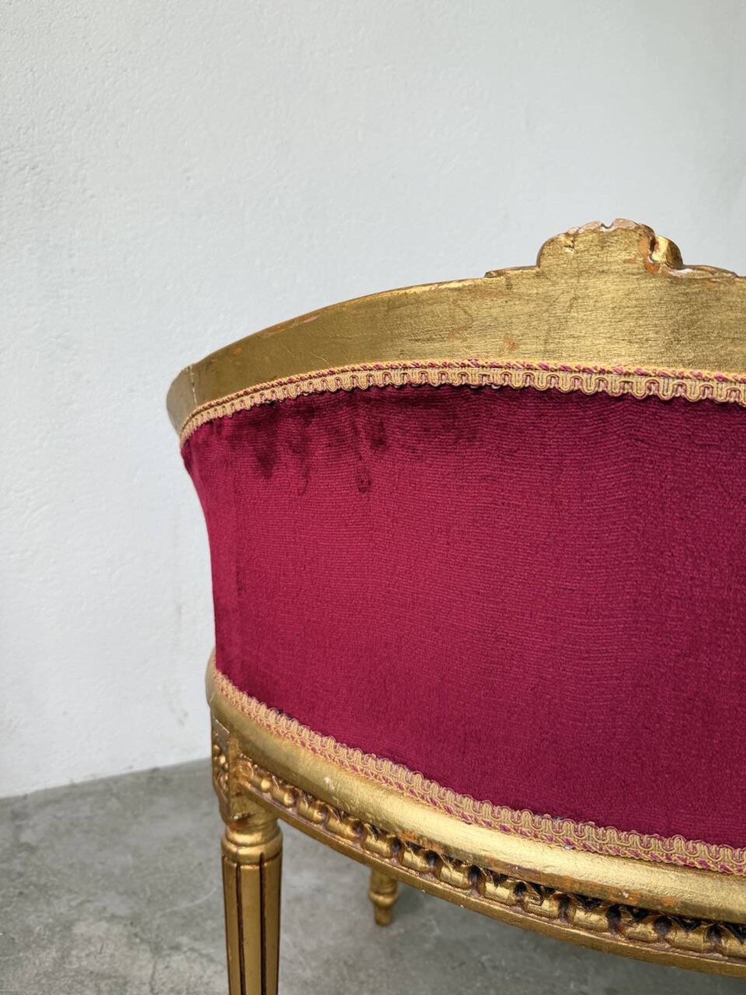 Louis XVI gilt wood and red velvet armchair