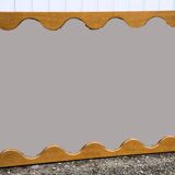 Large antique mirror with an oak frame.