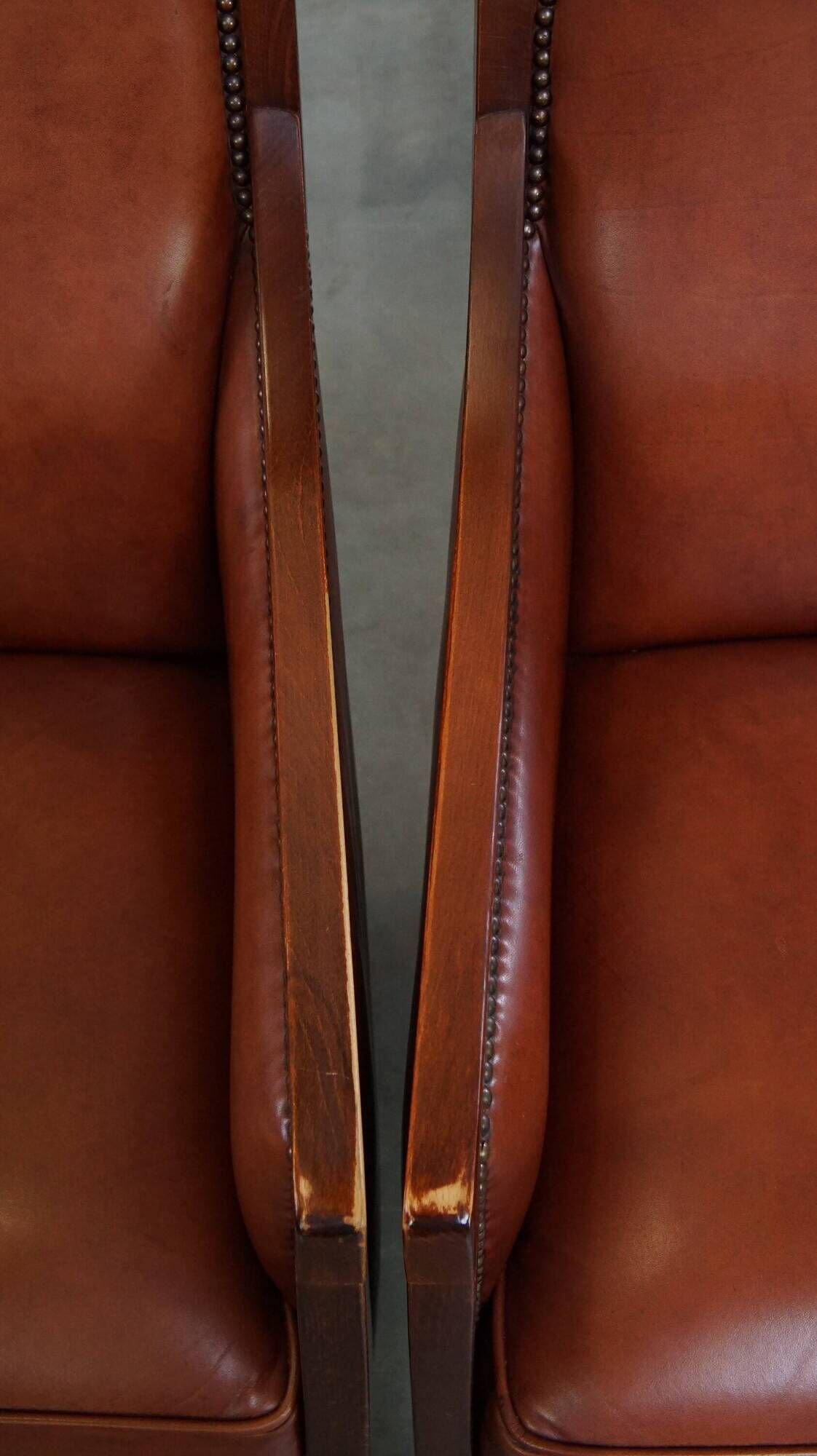 Majestic, luxurious set of 2 cognac-colored cowhide leather Art Deco design armchairs