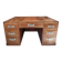 Large modernist minister's desk in solid lemon wood with 7 drawers.