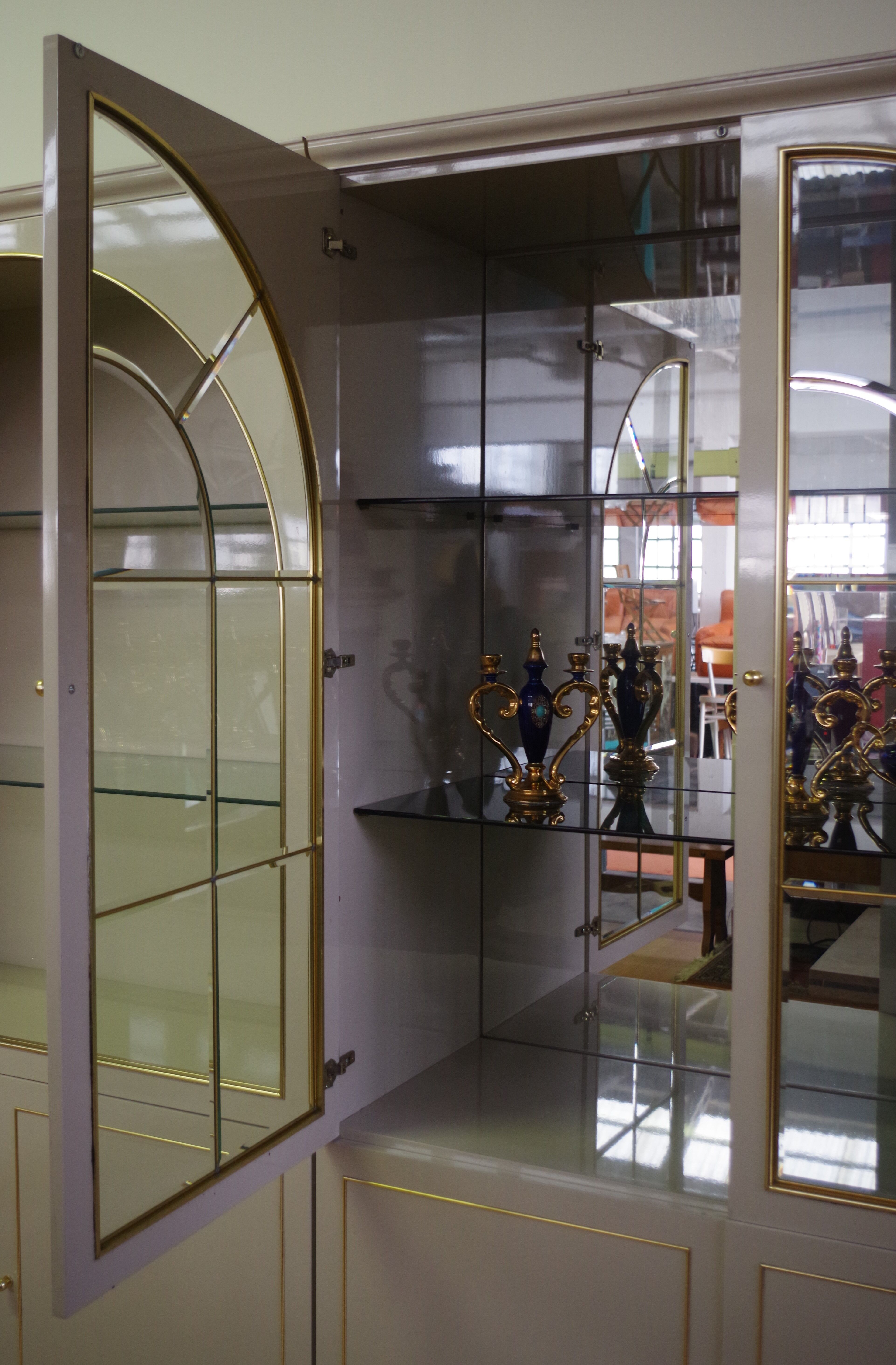 Showcases in lacquered wood, glass and brass  1970s, set of 4