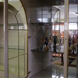 Showcases in lacquered wood, glass and brass  1970s, set of 4