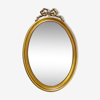 Vintage oval bow tie mirror