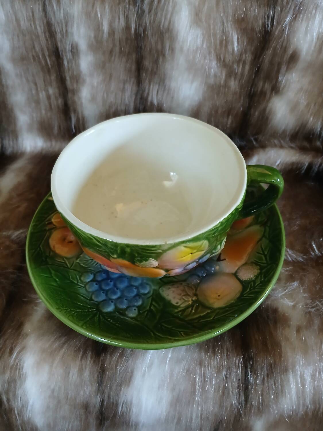Antique cup and saucer in slipware.
