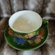Antique cup and saucer in slipware.