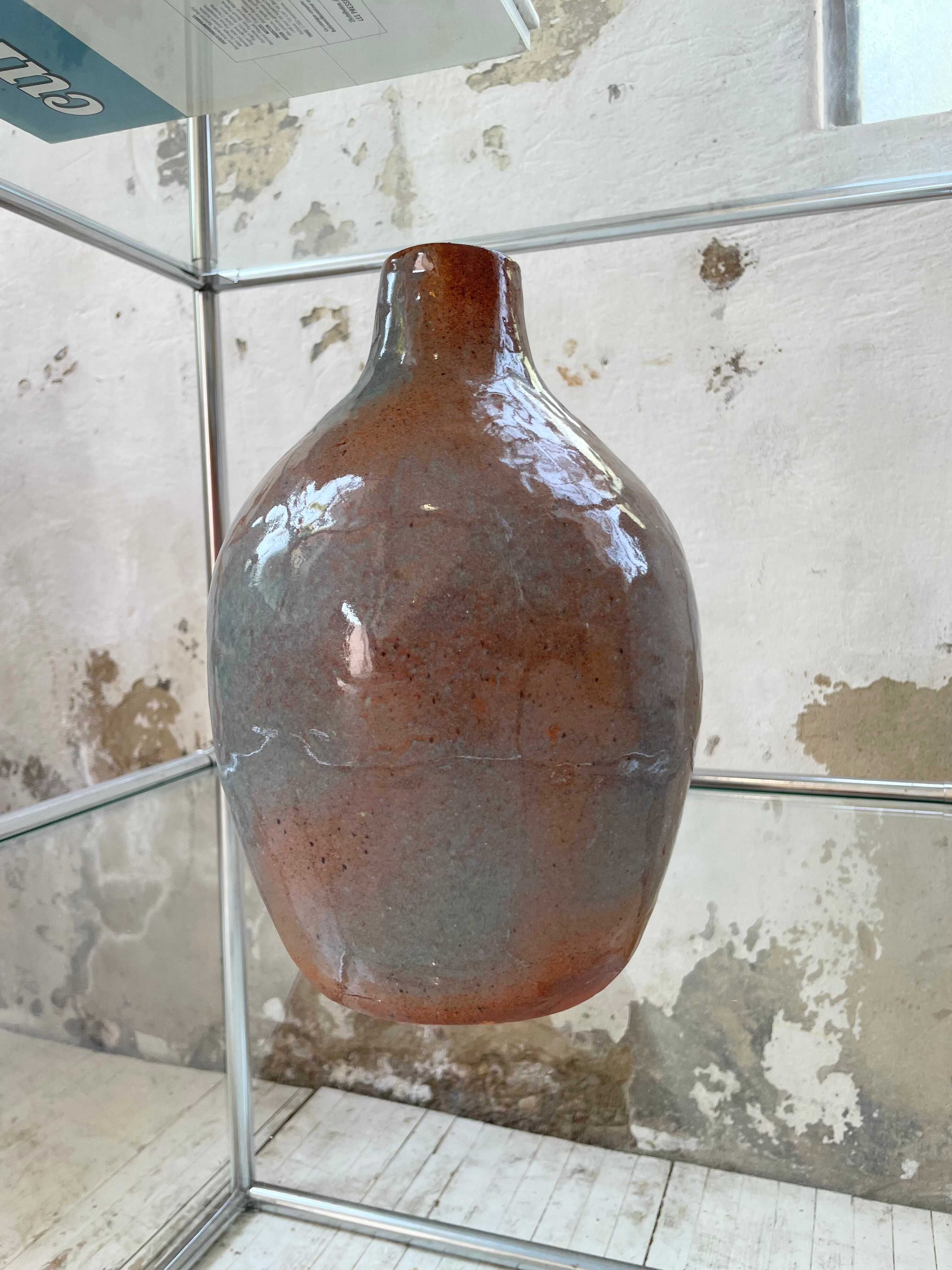 Glazed earth vase signed