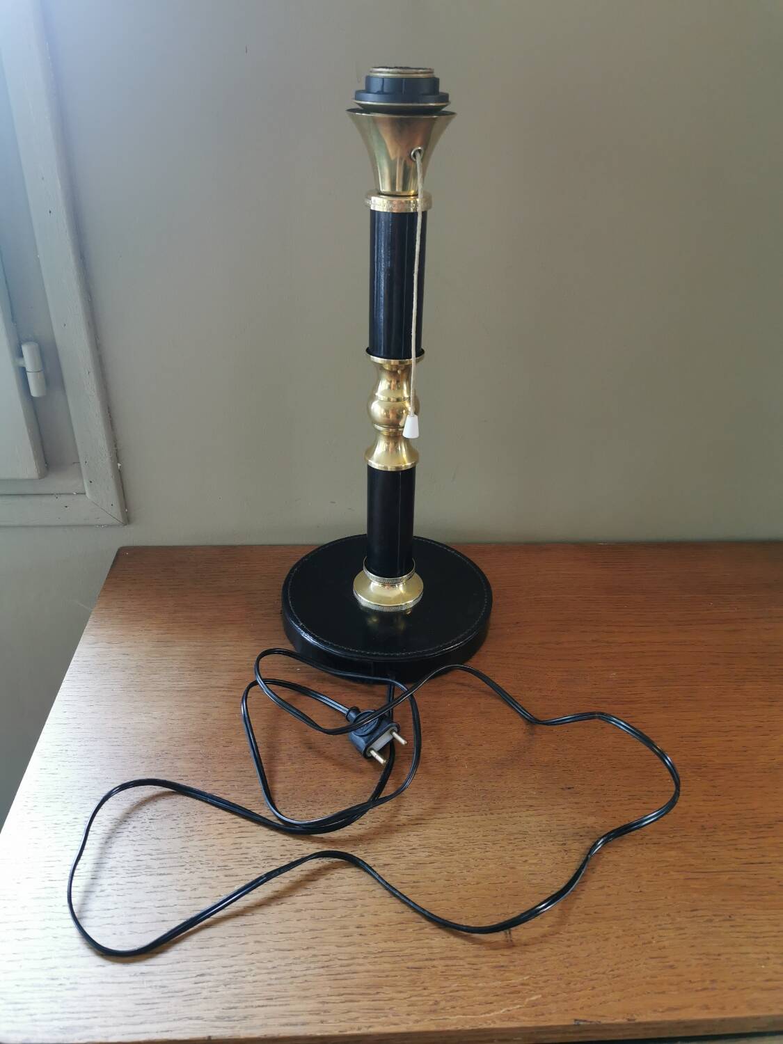 Vintage lamp base in black leather and brass