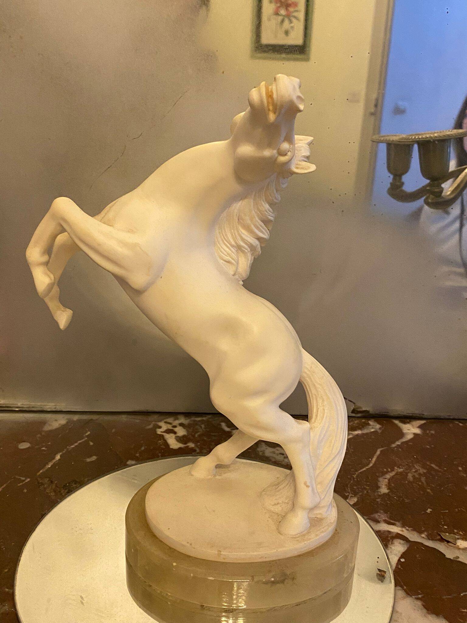 White rearing horse statuette
