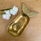 Empty vintage pear-shaped brass pocket