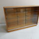 Vintage shop display cabinet with sliding doors