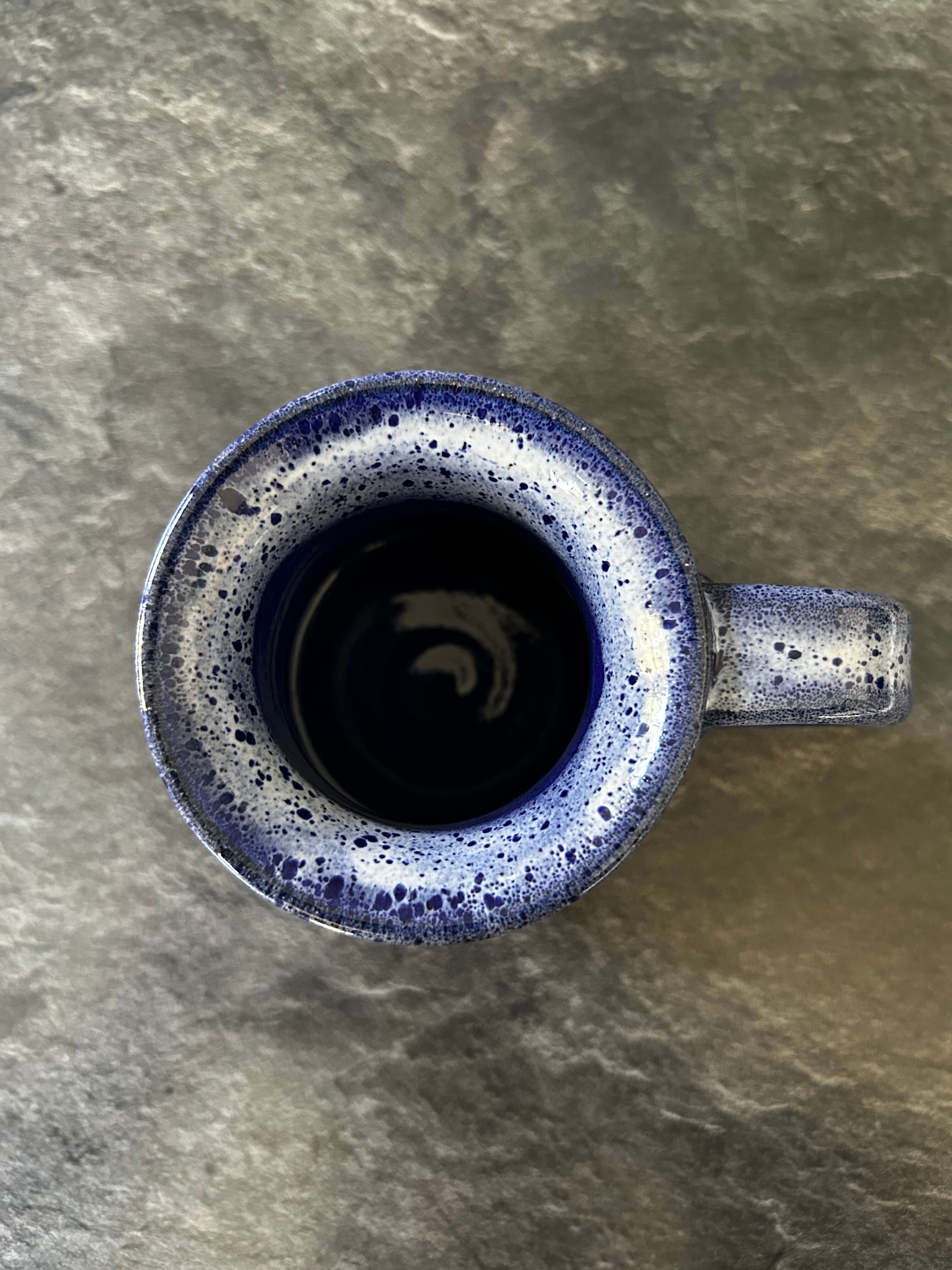 Small enamelled earthenware milk jug