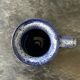 Small enamelled earthenware milk jug