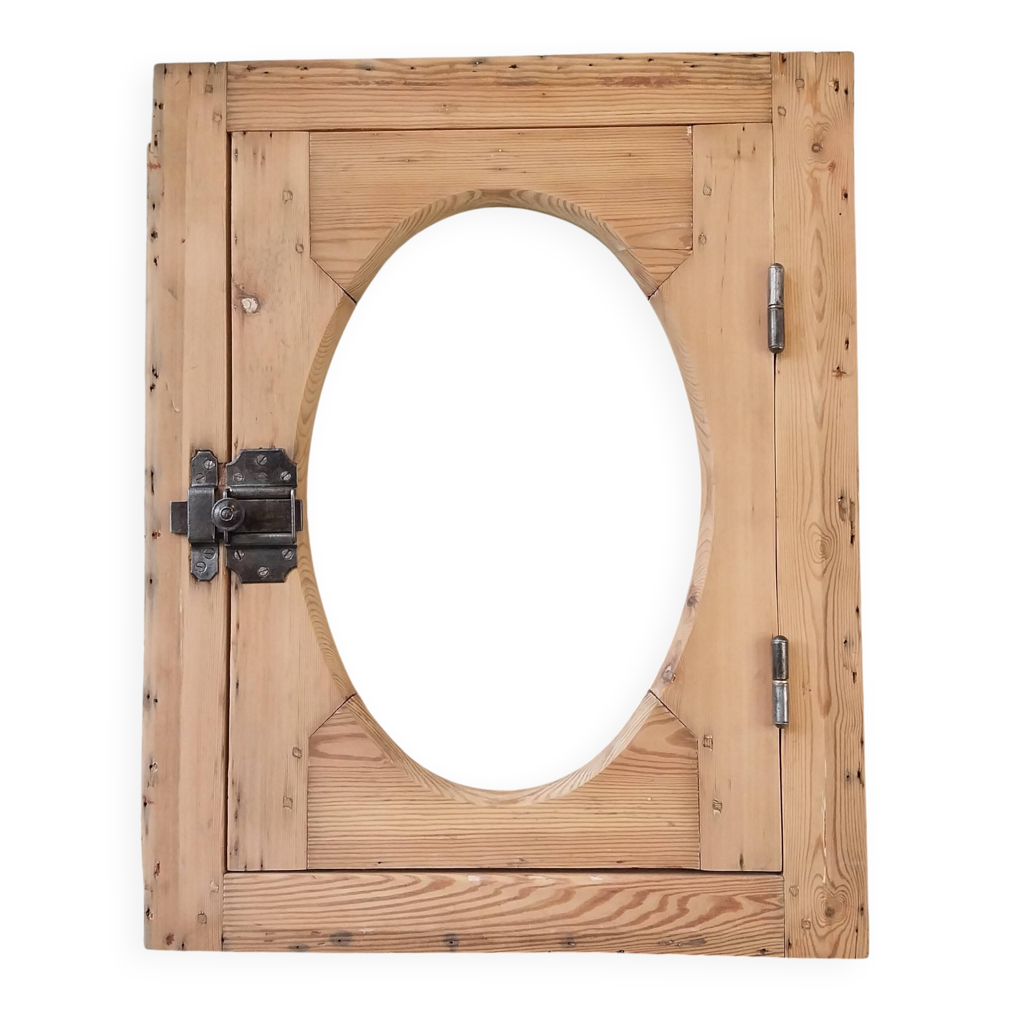 Old bullseye window with oval glass