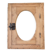 Old bullseye window with oval glass