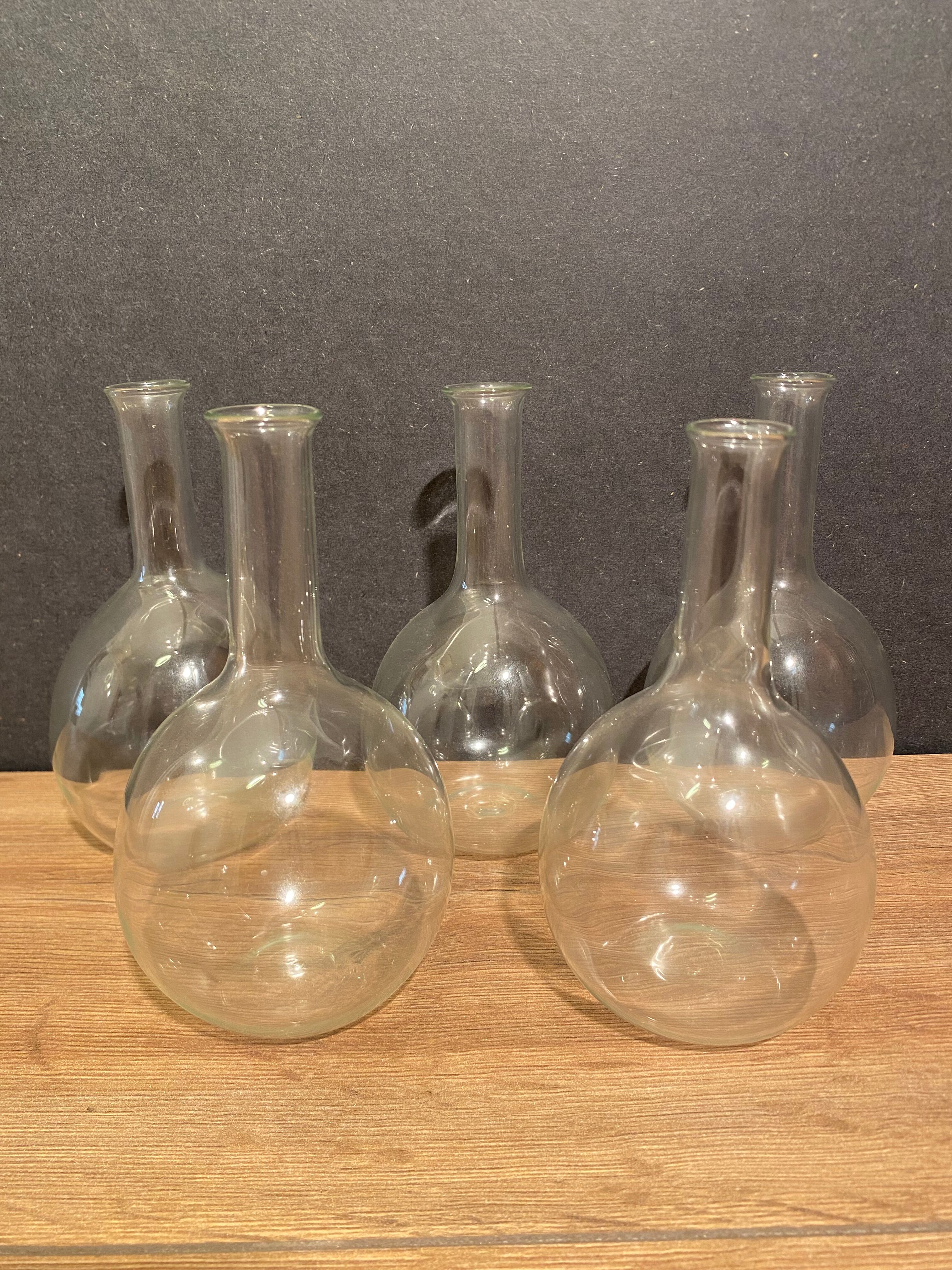 Suite of 5 bakings, bottles with long glass neck