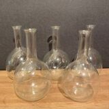 Suite of 5 bakings, bottles with long glass neck