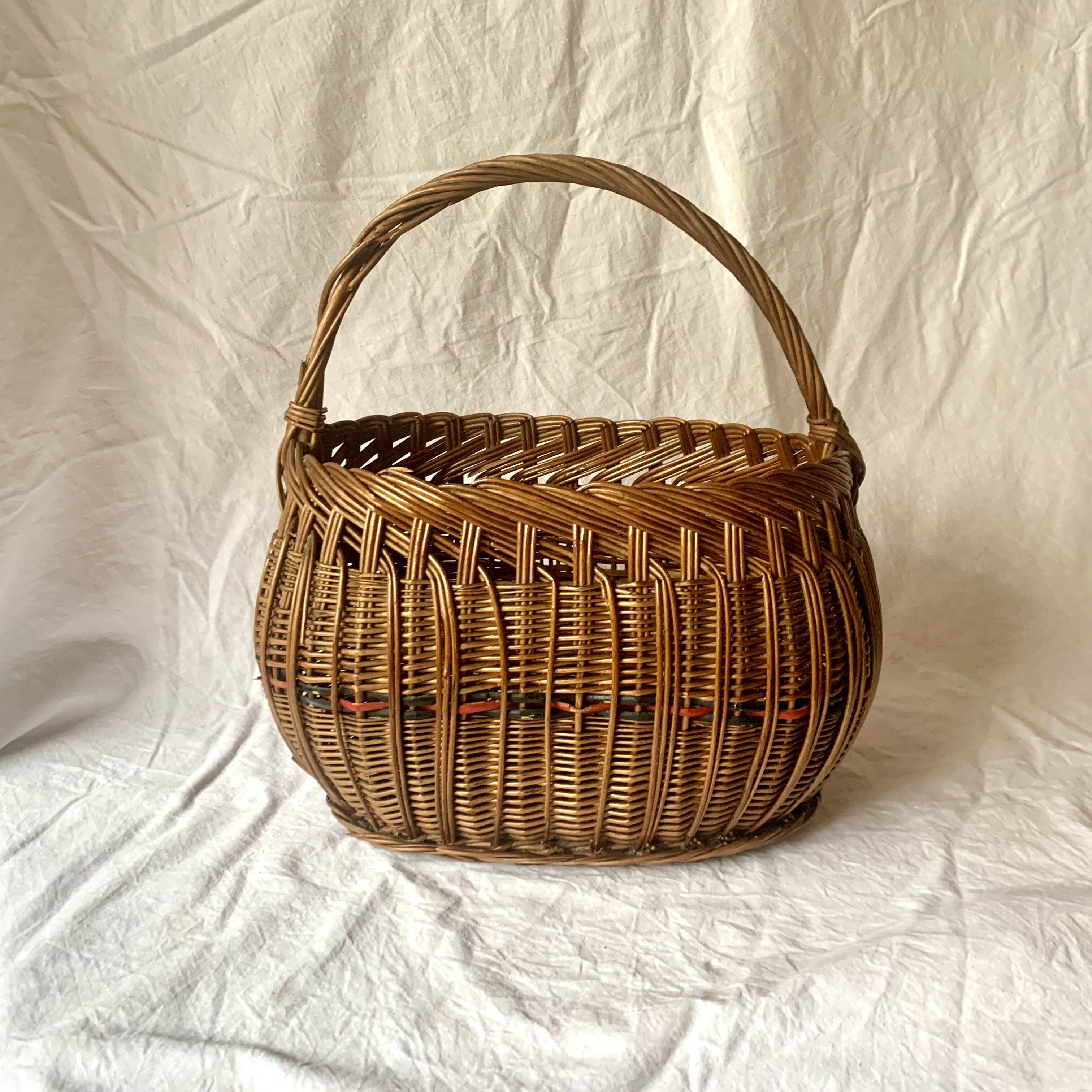 Old woven wicker basket and scoubidou