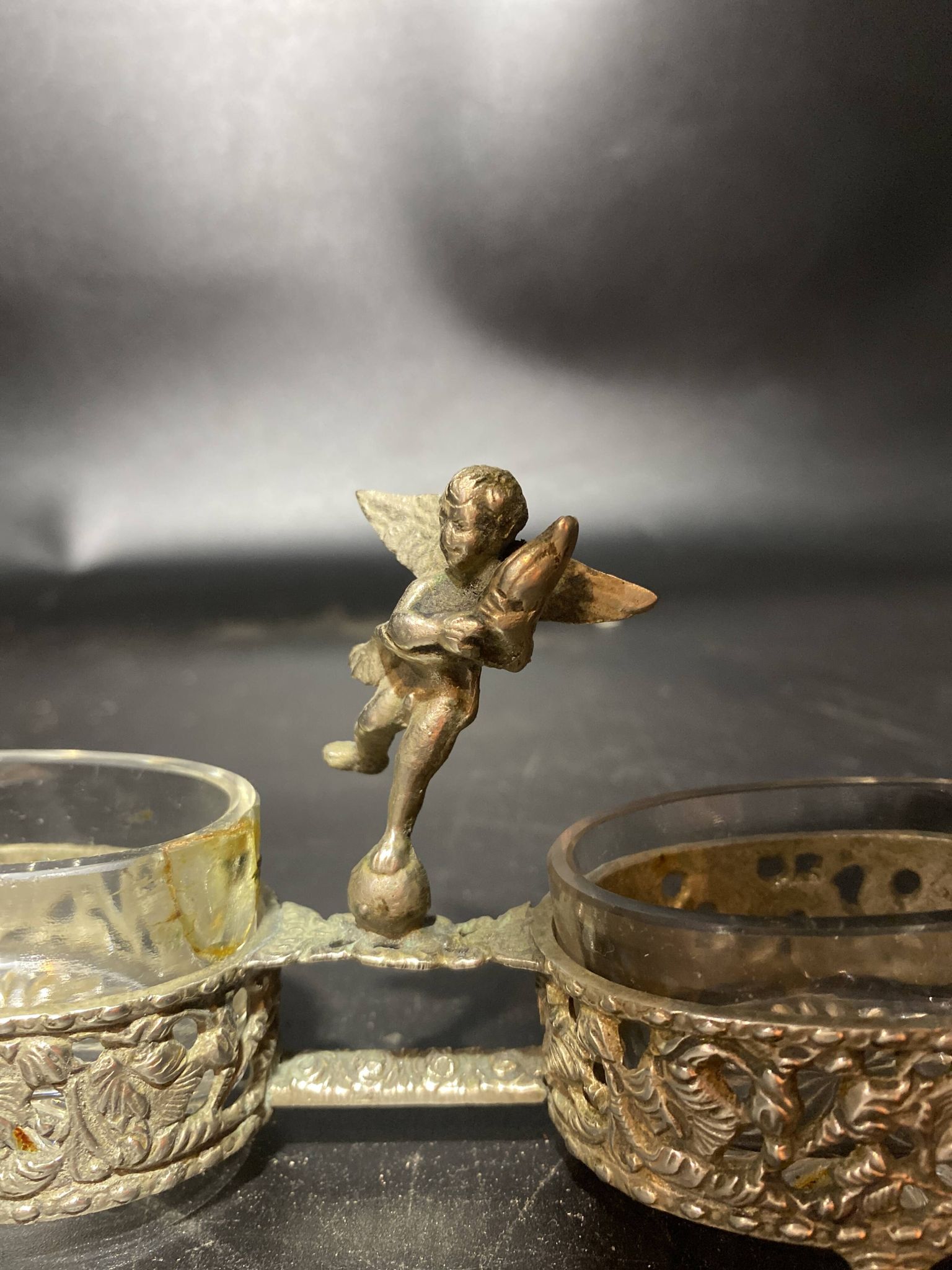 Spice centerpiece and serving spoon topped with a brass cherub