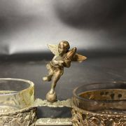 Spice centerpiece and serving spoon topped with a brass cherub