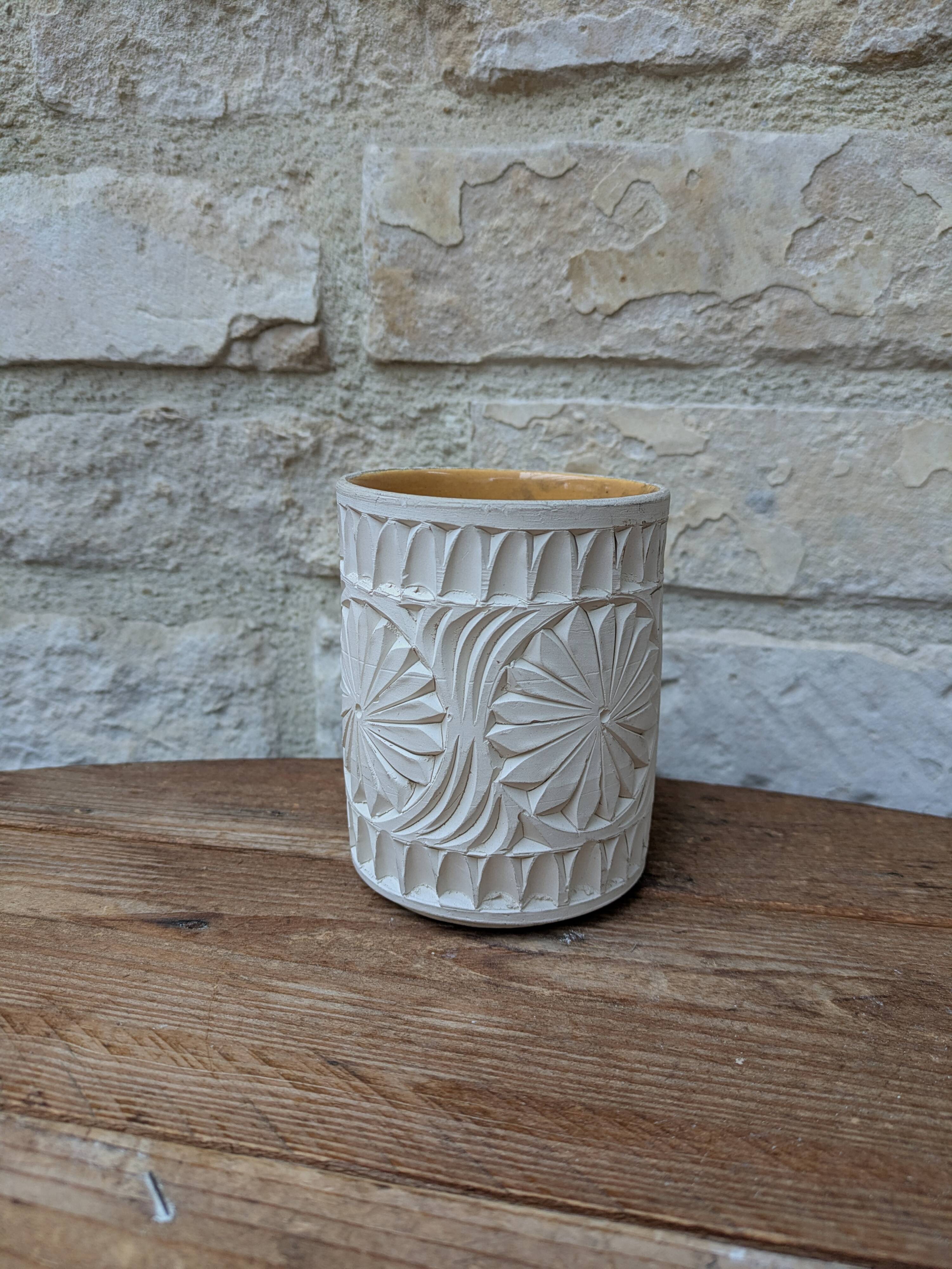 Old terracotta mug with glazed interior