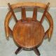 Antique captain's swivel chair on a draft horse wheel from around 1760.