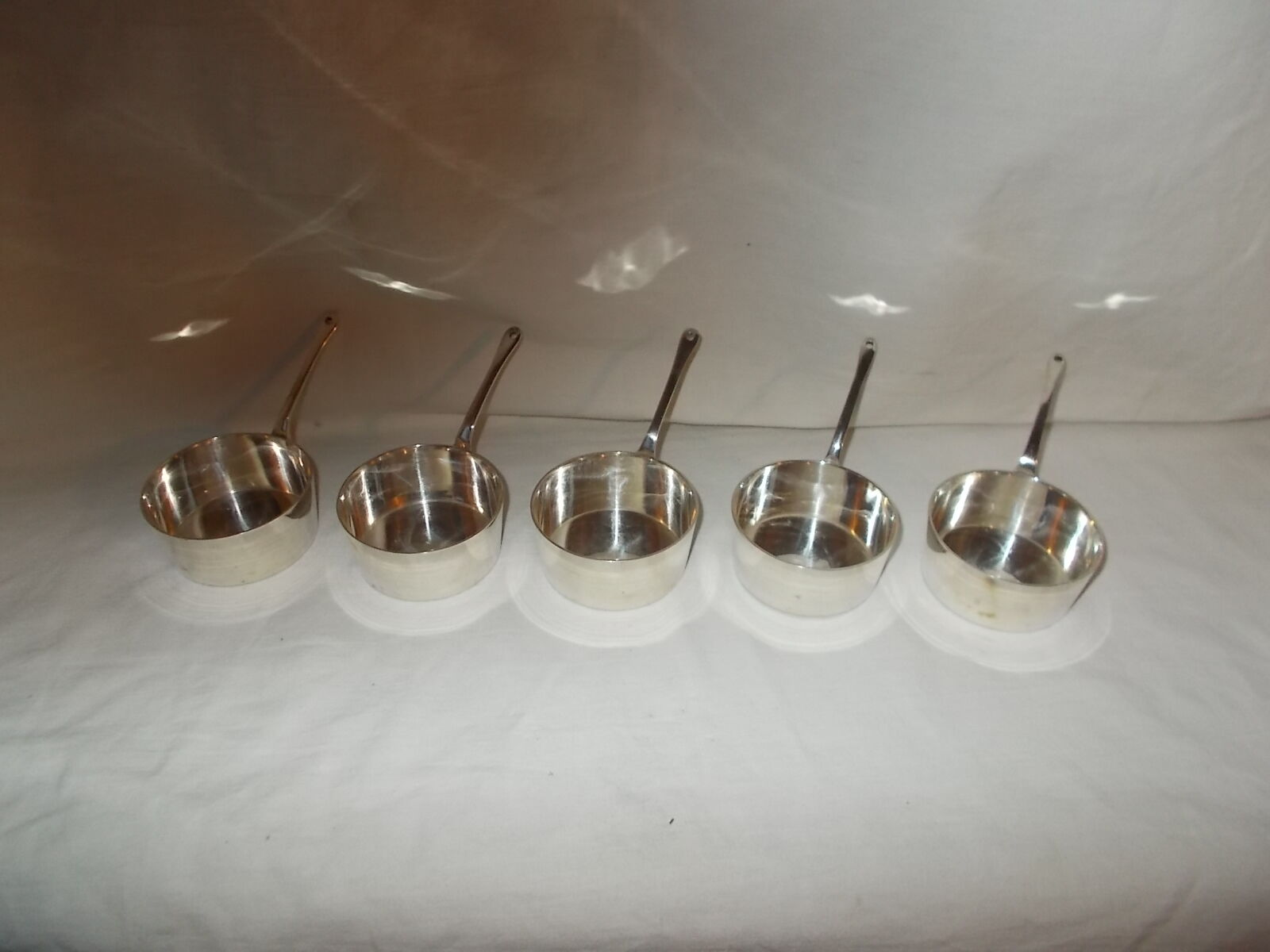 Set of 5 small silver metal poelons