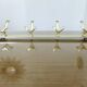 Large wall-mounted coat rack in gold aluminum, 60s-70s