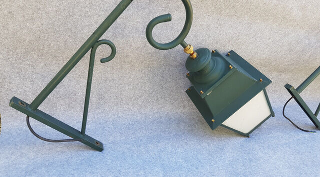 Pair of antique lanterns on its gallows