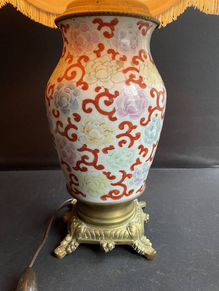 Old Asian vase mounted as a lamp with pagoda lampshade