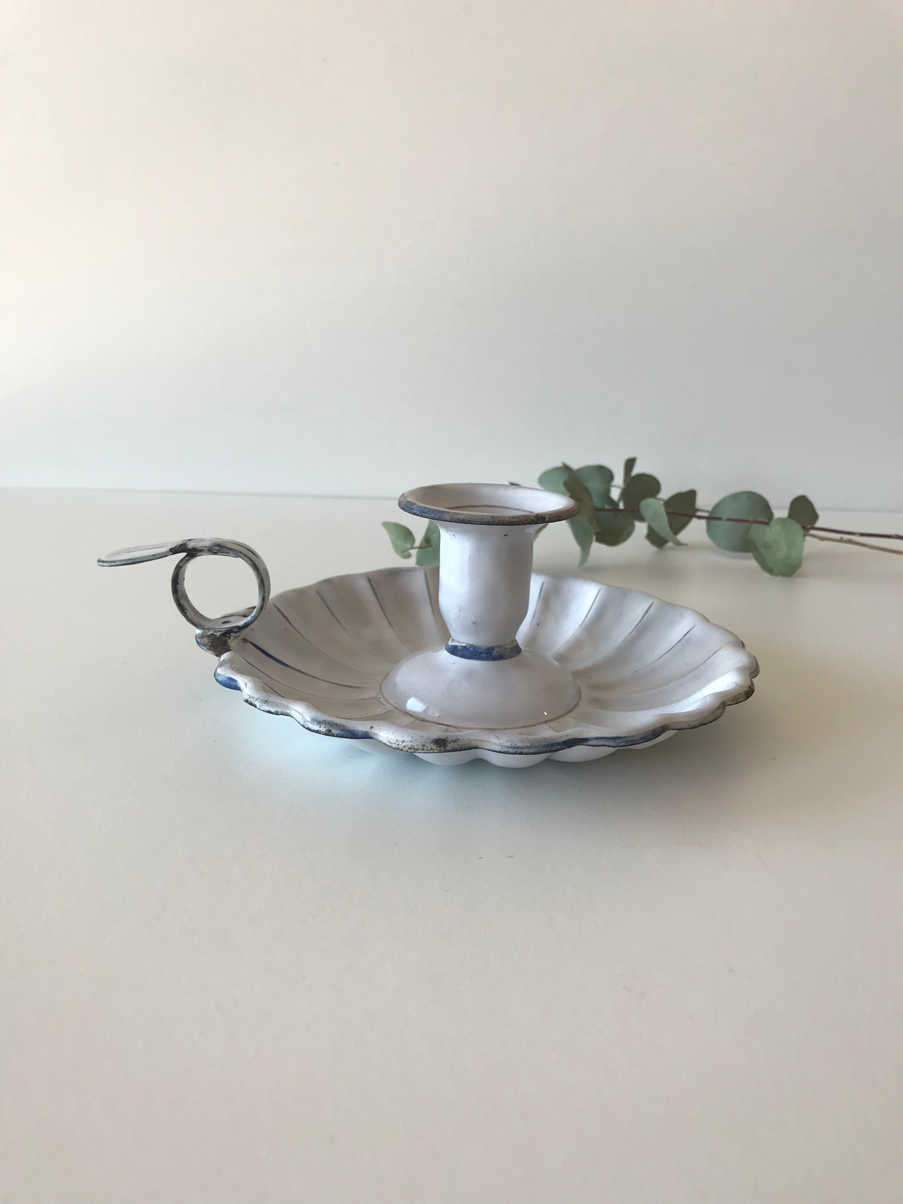 Candlestick in white enameled metal