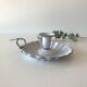 Candlestick in white enameled metal