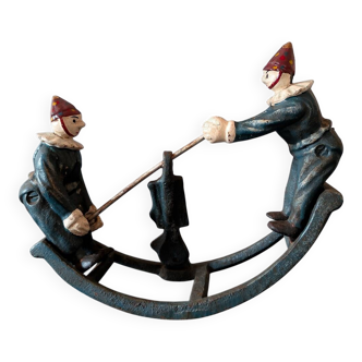 Vintage toy "Painted cast iron clown seesaw" from the 1930s