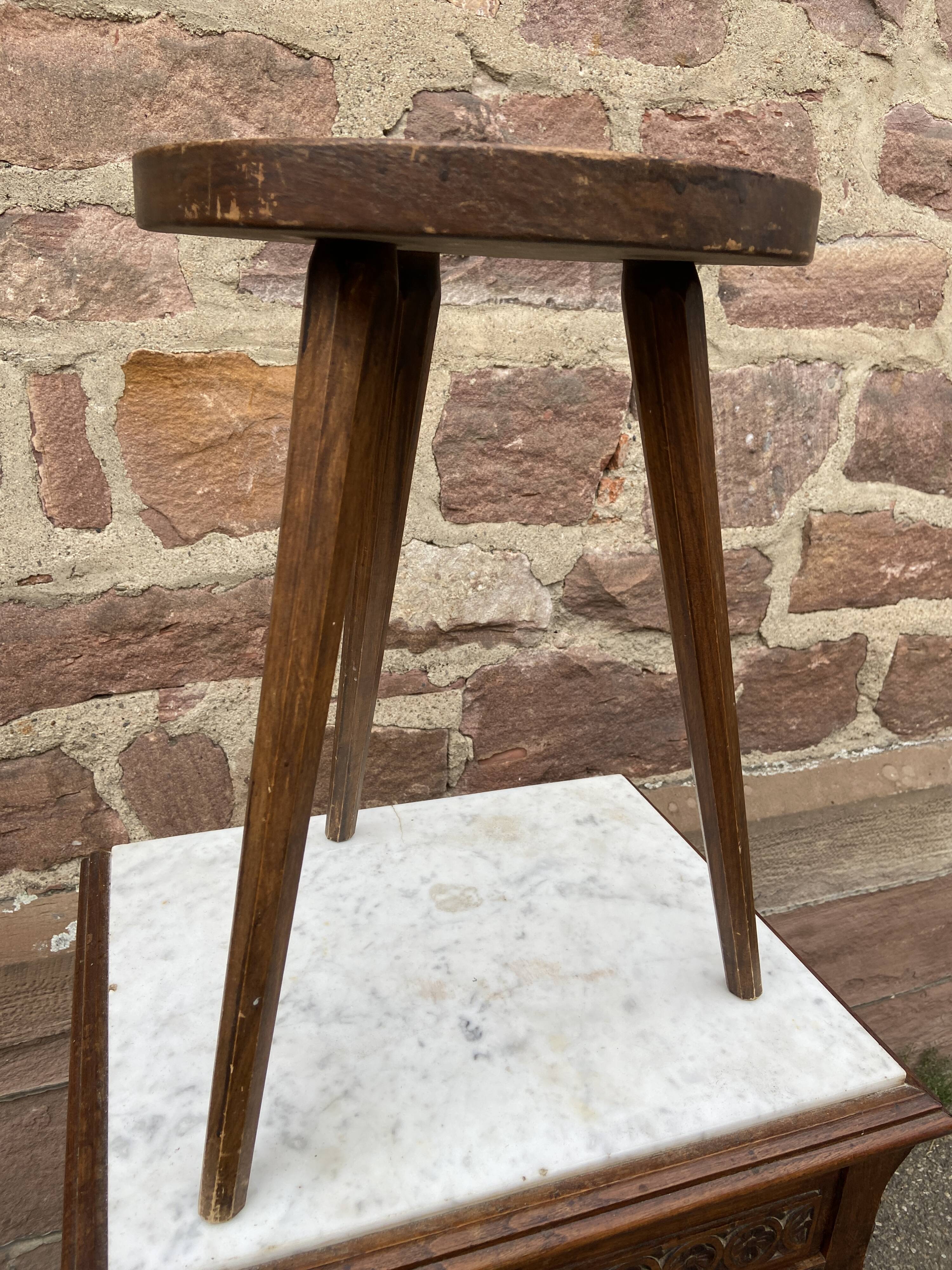 Brutalist rustic tripod farm stool made of vintage wood