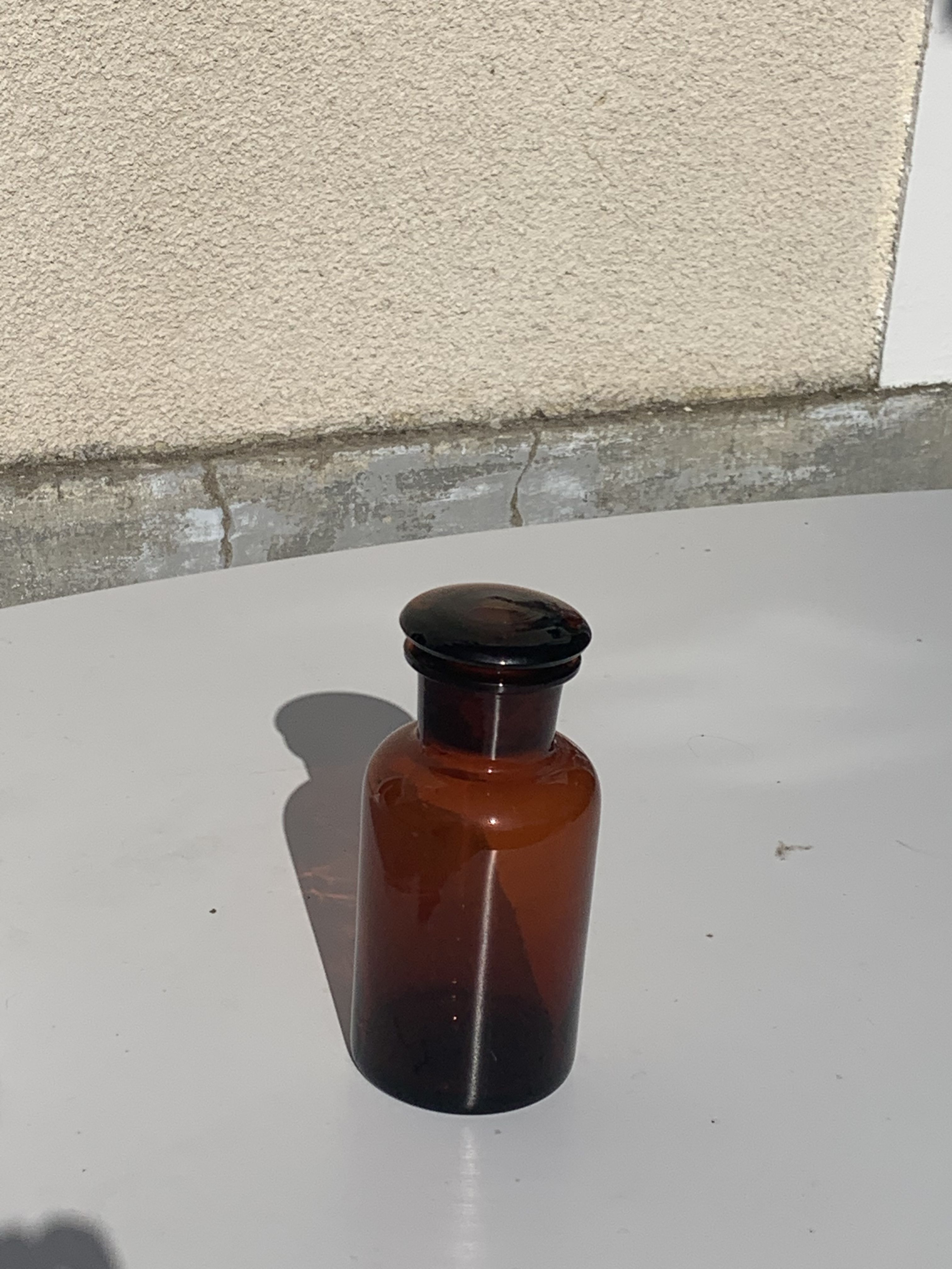 Jar bottle of herbalism pharmacy in amber colored glass art deco