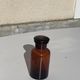 Jar bottle of herbalism pharmacy in amber colored glass art deco