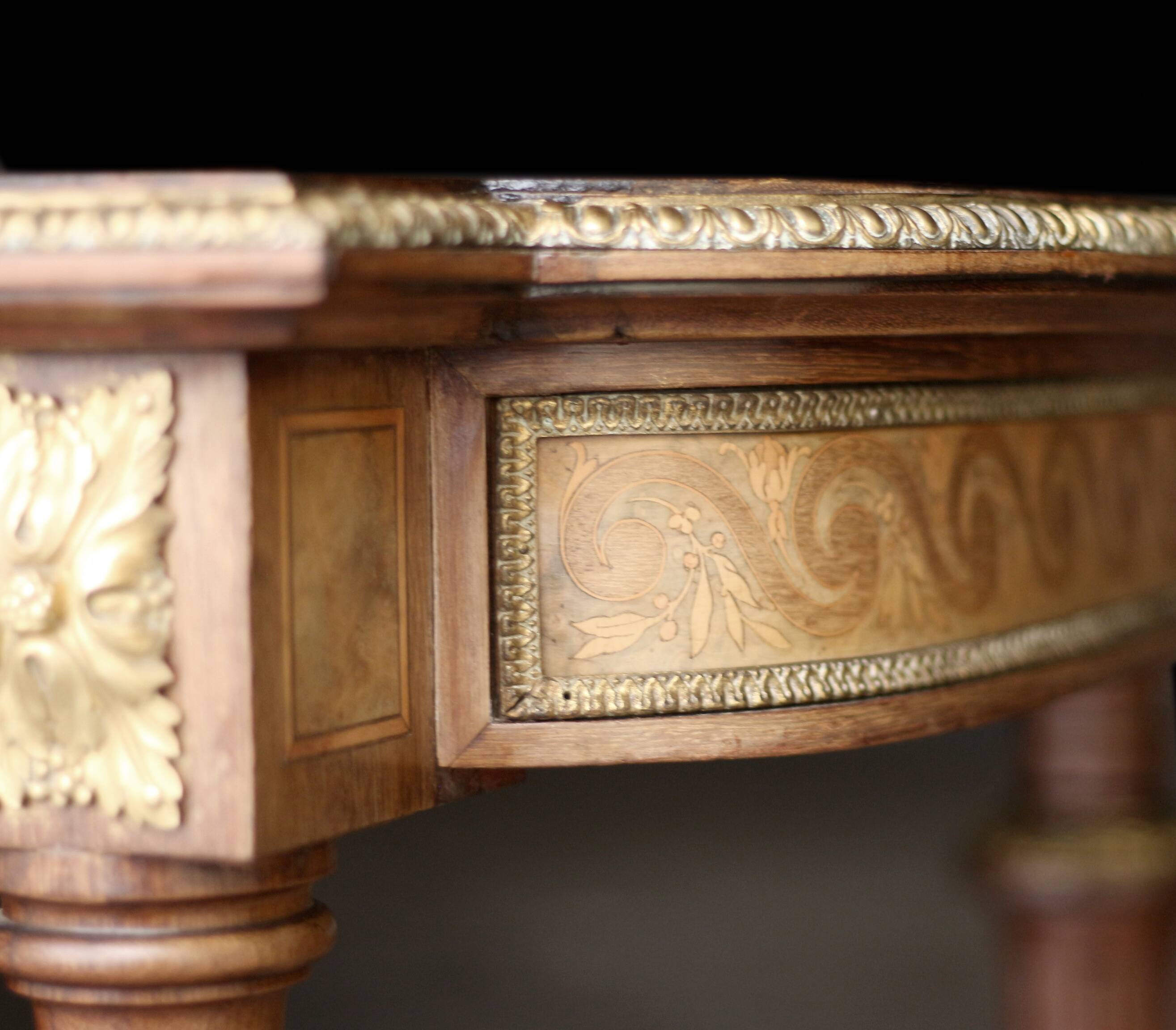 Superb Napoleon III table. Marquetry top and gilded bronzes.
