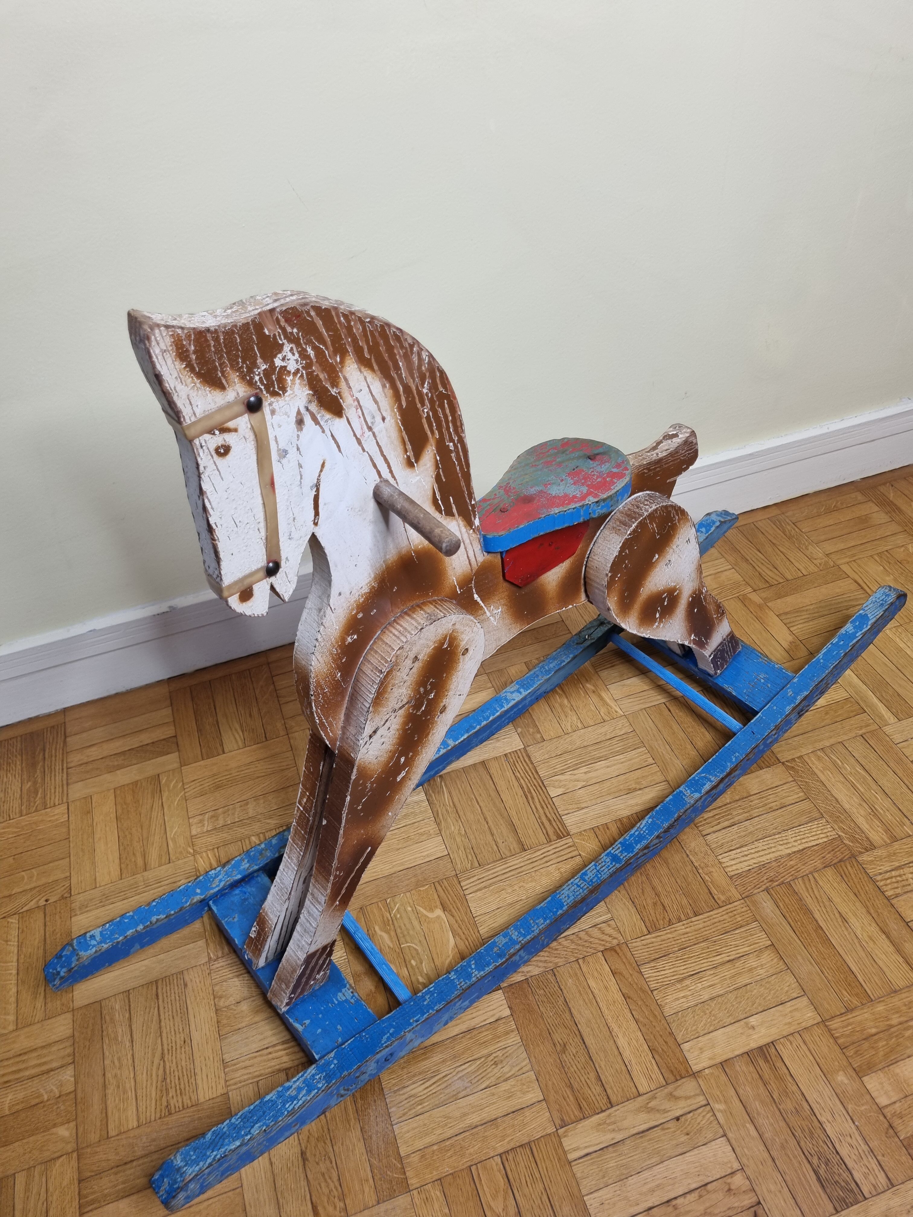 Old rocking horse in painted wood, 50s
