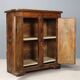Antique pine wardrobe painted in walnut stain, restorations, Italy, 17th century.