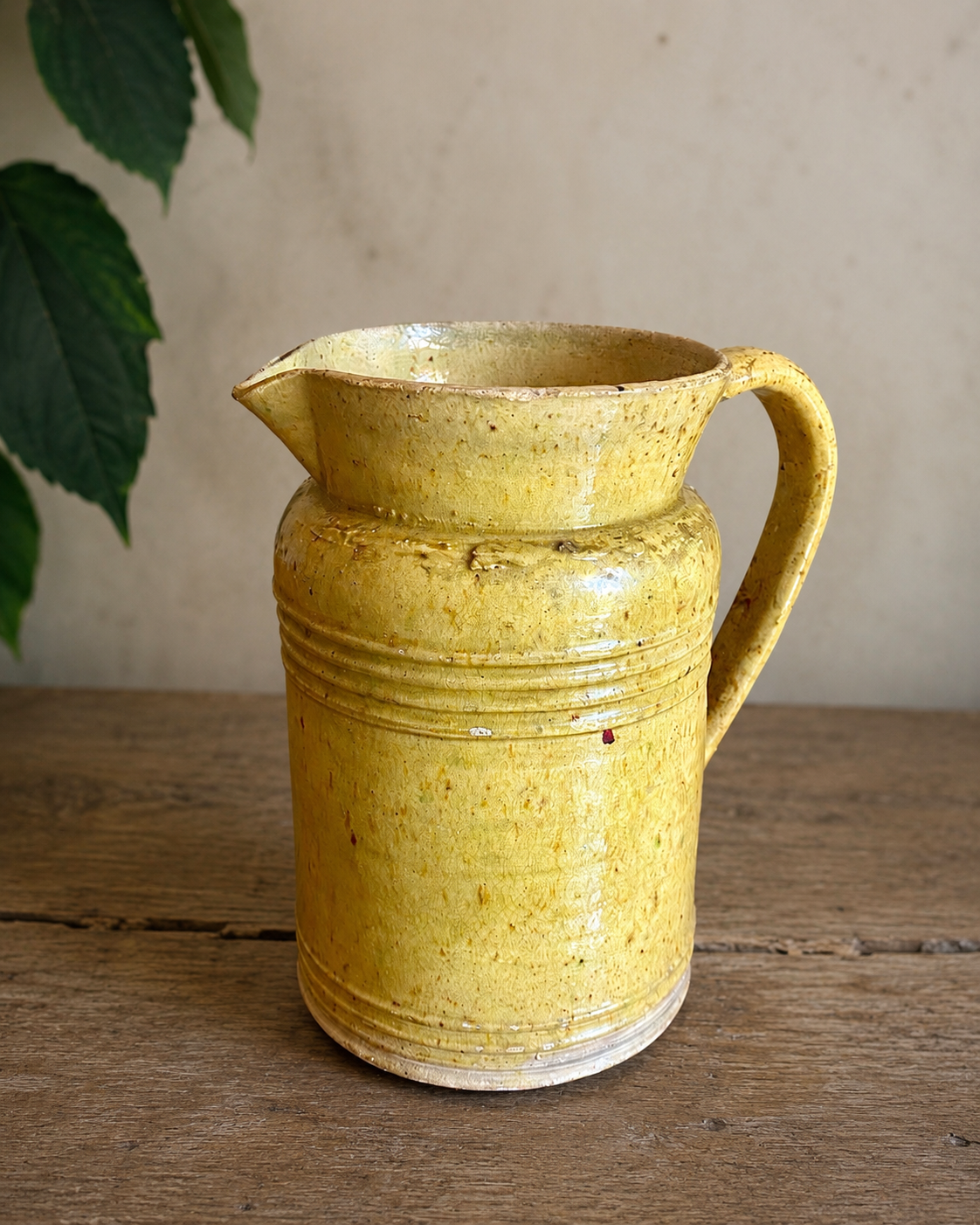 Old yellow glazed terracotta jug from southern France.