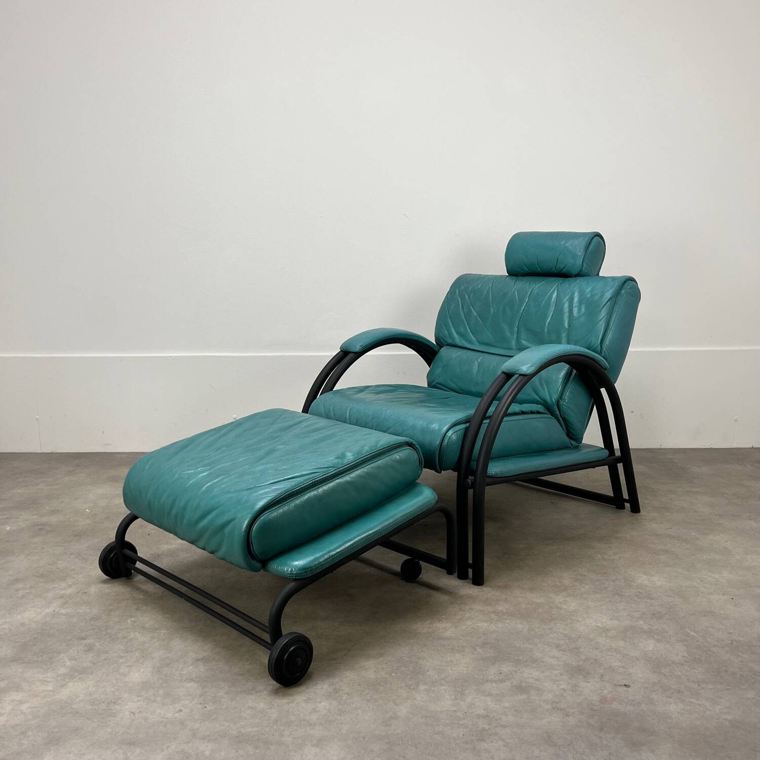 Postmodern design armchair and ottoman, 80s leather