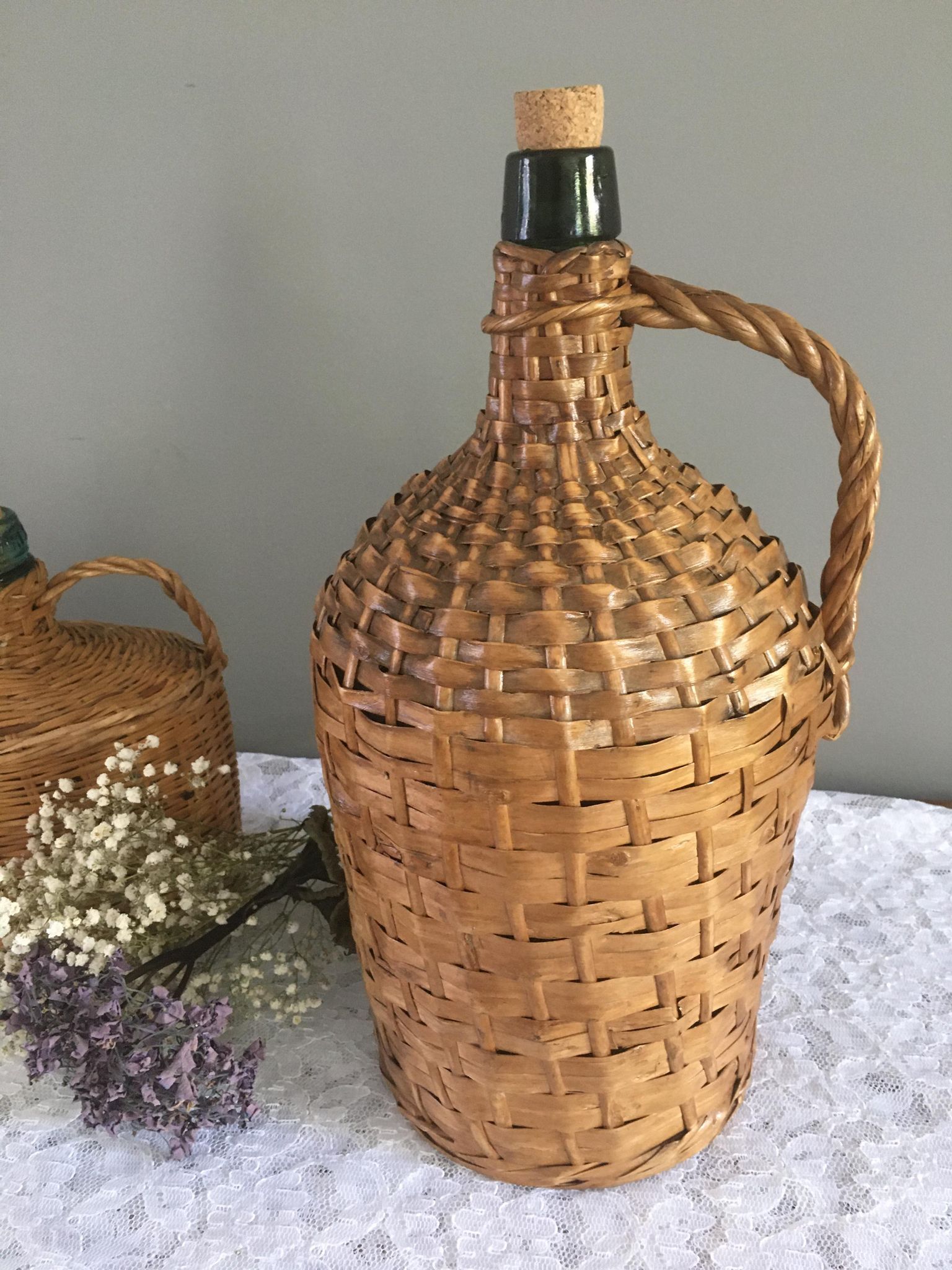 Vintage Dame-Jeanne duo and their rattan/wicker dresses