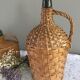 Vintage Dame-Jeanne duo and their rattan/wicker dresses