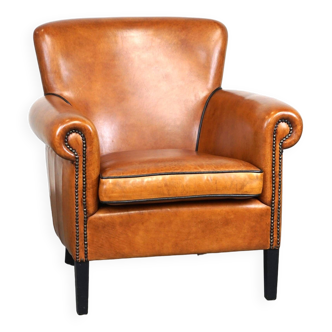 Fauteuil en cuir de mouton en excellent état