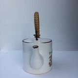 Vintage teapot with wicker handle