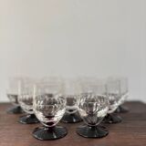 Set of 9 digestive glasses with chiseled garnet art deco feet