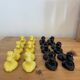 Box of 12 dog-shaped cutlery rests in yellow and black majolica.
