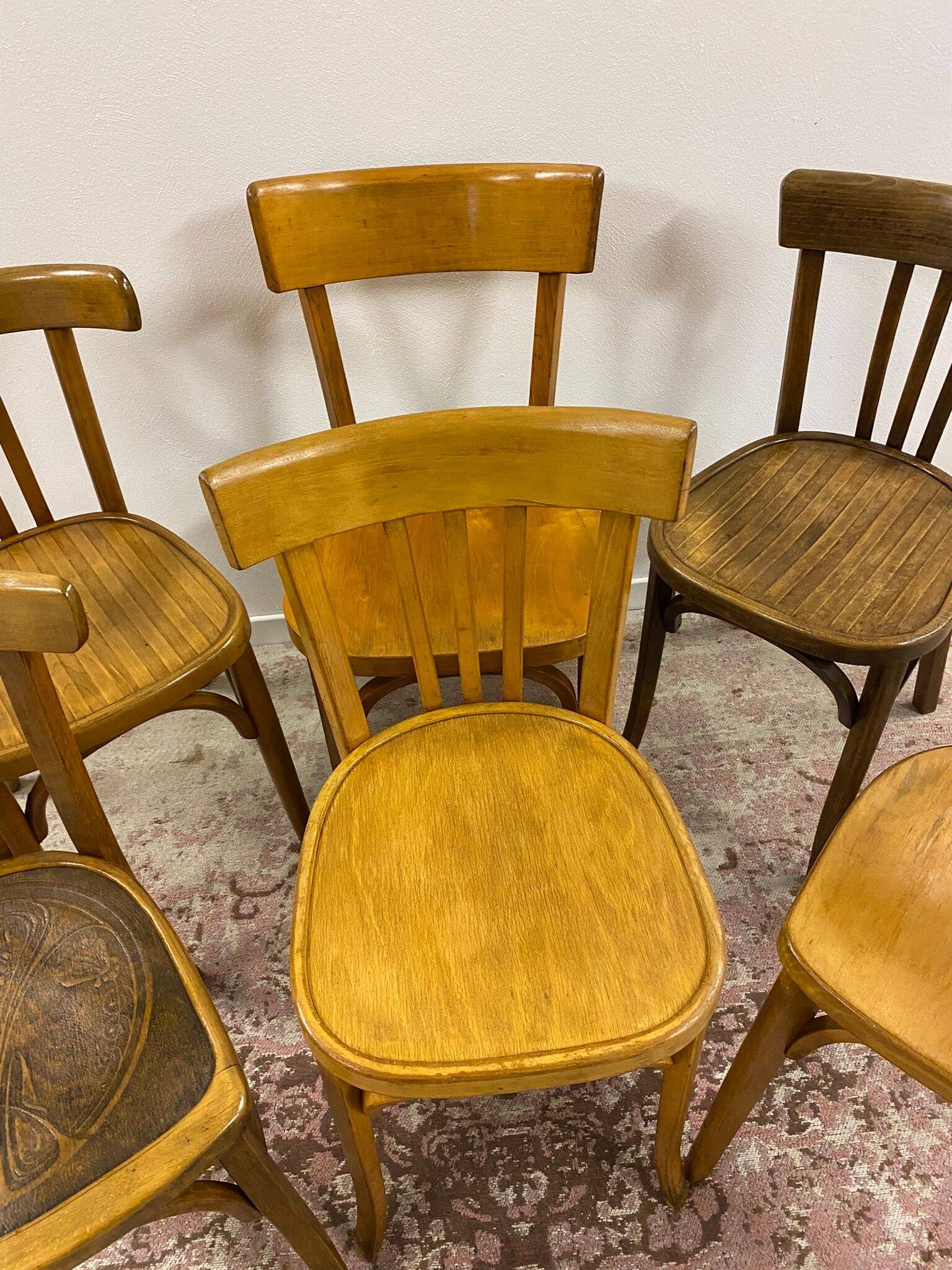 Set of 6 mismatched bistro chairs including Baumann and Luterma chairs