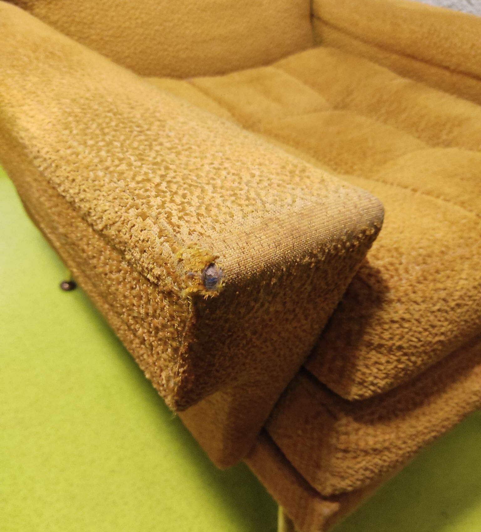 Old velvet heating chair on metal legs