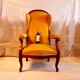 Fauteuil voltaire à oreilles, tissu jaune, XXe siècle